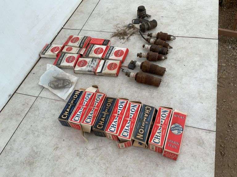 Quantity of new and used Champion spark plugs, quantity of brushes for Model T