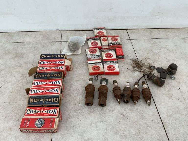 Quantity of new and used Champion spark plugs, quantity of brushes for Model T