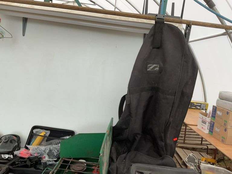 Pair of snowboarding bindings, gears, handlebar bag, Coleman camp stove, garment bag, miscellaneous