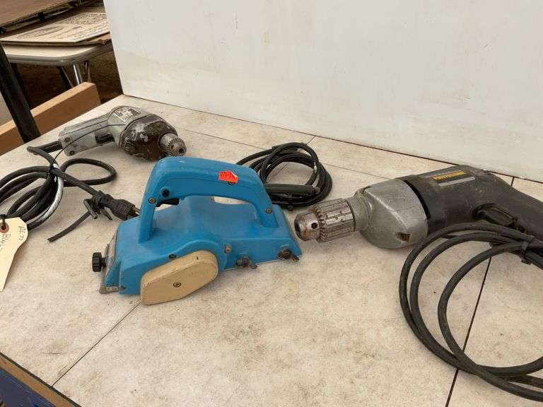 Running 1/4" Black & Decker and 1/2" drills, working Makita hand planer