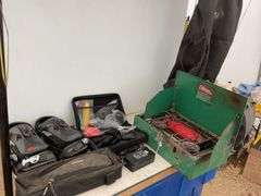 Pair of snowboarding bindings, gears, handlebar bag, Coleman camp stove, garment bag, miscellaneous