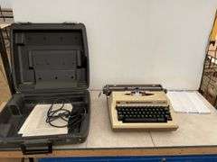 Vintage electric typewriter in case