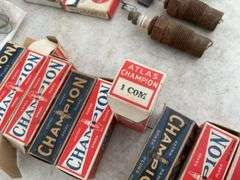 Quantity of new and used Champion spark plugs, quantity of brushes for Model T