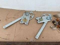 Set of unused window cranks for Model T, Model T light bar, and miscellaneous lightbulbs and brushes