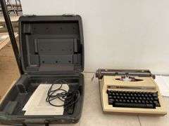 Vintage electric typewriter in case