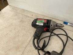 Working 1/2" Black & Decker electric drill, a working 3/8" Craftsman electric drill, and electric st