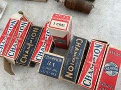 Quantity of new and used Champion spark plugs, quantity of brushes for Model T