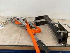 Ratcheting strap, spare tire carrier