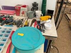 Plastic tote, quantity of screwdrivers, sawhorse brackets, miscellaneous measuring cups, ice cube tr