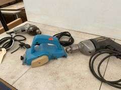Running 1/4" Black & Decker and 1/2" drills, working Makita hand planer