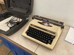 Vintage electric typewriter in case