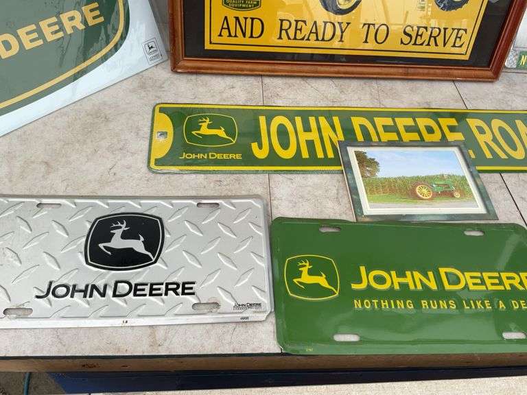 Quantity of John Deere license plates, print etc