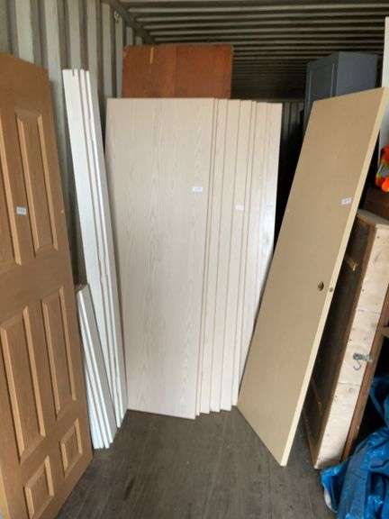 10 - unused 28” x 80” interior doors, several door jams, 1 - 24” x 80" interior door