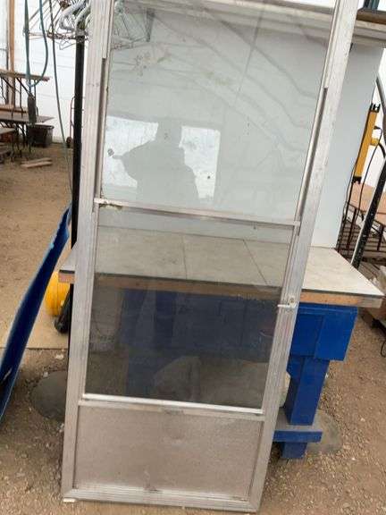 Used 32 x 80 storm door comes with screen