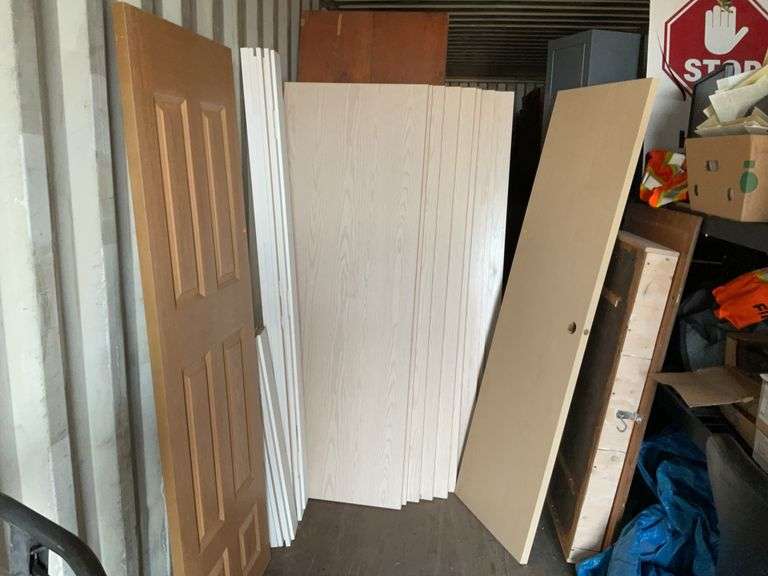 10 - unused 28” x 80” interior doors, several door jams, 1 - 24” x 80" interior door