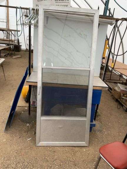 Used 32 x 80 storm door comes with screen