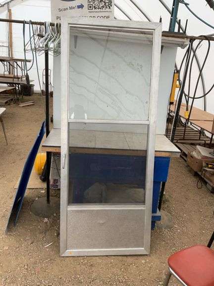 Used 32 x 80 storm door comes with screen
