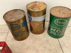 3 Esso oil tins with oil in them, cans are dented, also 2 Marconi 3-D six tubes