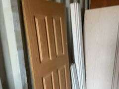 10 - unused 28” x 80” interior doors, several door jams, 1 - 24” x 80" interior door