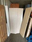 10 - unused 28” x 80” interior doors, several door jams, 1 - 24” x 80" interior door