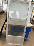 Used 32 x 80 storm door comes with screen