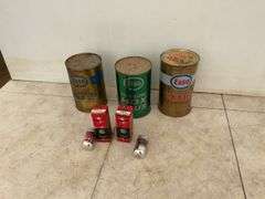 3 Esso oil tins with oil in them, cans are dented, also 2 Marconi 3-D six tubes
