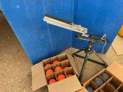 Clay pigeon thrower and a quantity of clay pigeons