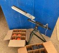 Clay pigeon thrower and a quantity of clay pigeons