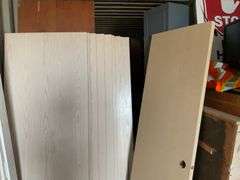 10 - unused 28” x 80” interior doors, several door jams, 1 - 24” x 80" interior door