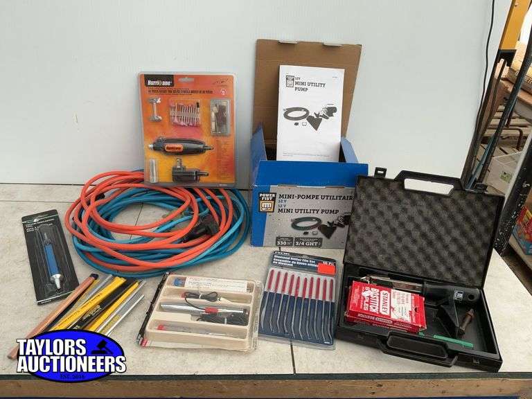 Mini utility pump, quantity of carpenters pencils, extension cords, rotary tool, etc.