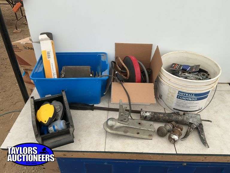 Bucket of screws and miscellaneous, tank heater, trailer balls, chalk line, prybar etc.