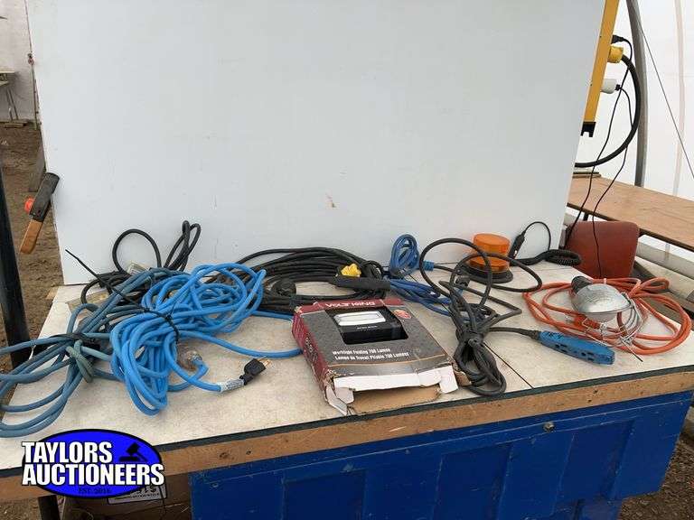 Quantity of extension cords, trouble light and a work light