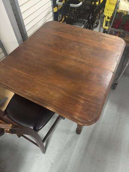 Early 20th Century 5th Leg Dining Table on casters.