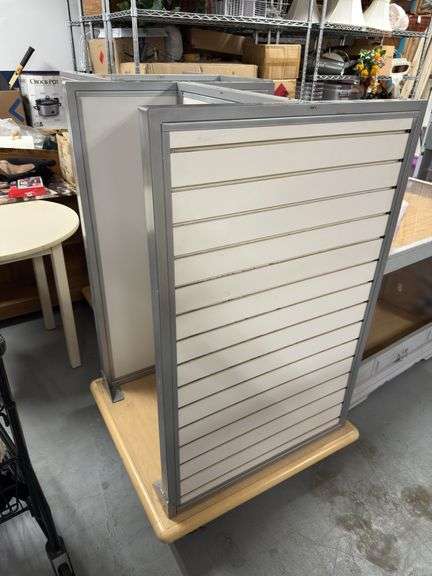 Retail 4 sided fixture. Slat wall. On wheels. We have 4 of these. Live auction will take first choic