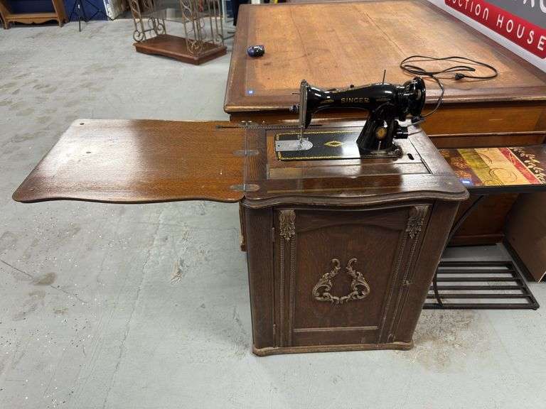 Antique Singer sewing machine. Auto hide with door opening and closing.