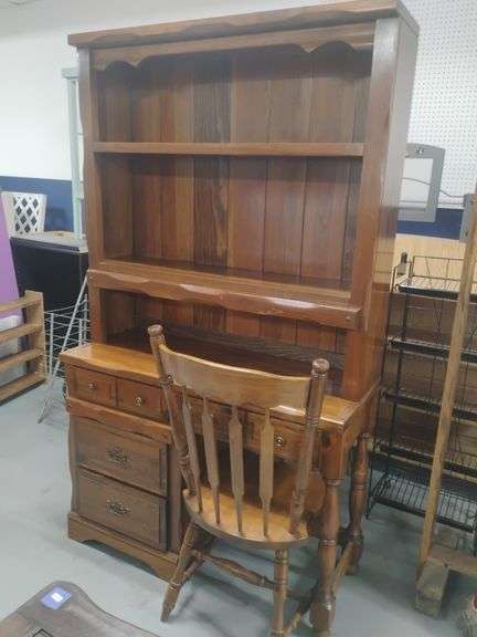 Wooden 4 drawer desk with bookshelf and chair. Measures 6' tall x 42" wide x 17" deep.