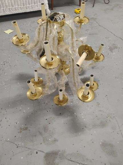 15 bulb, 3 tier brass chandelier by Kichler Lighting. 20" tall x 22" wide. Minimal repair needed for