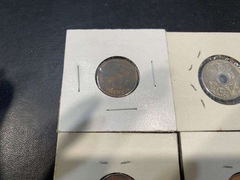 Small Collection of World Coins in Pockets