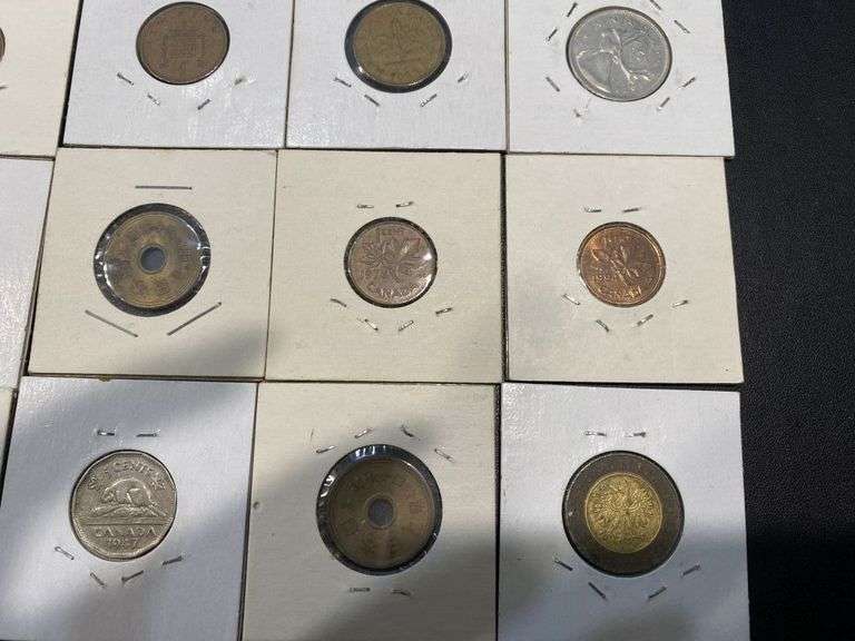 Small Collection of World Coins in Pockets