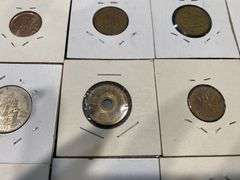 Small Collection of World Coins in Pockets
