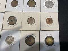 Small Collection of World Coins in Pockets