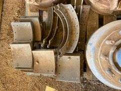 Brake Drums and Parts.  Axle is bent.