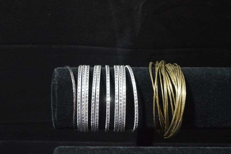 BANGLES: 11 SILVER COLORED & 1 GOLD COLORED