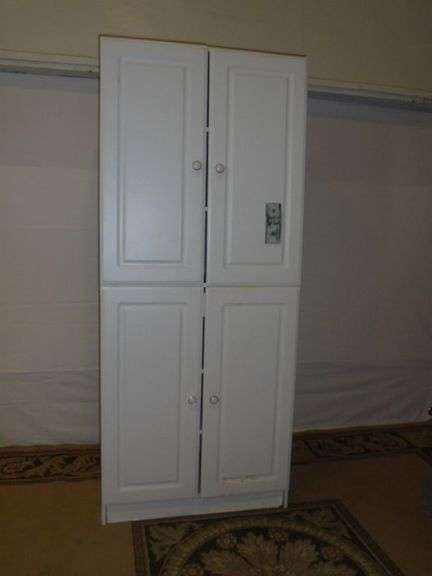 Storage Cabinet w/ center drawer and shelves inside. See additional pic 30 x 16 x 71 tall.