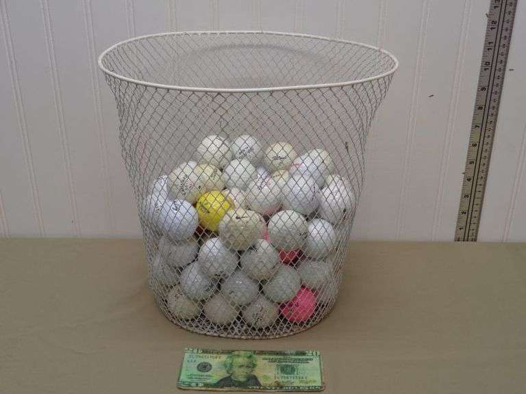 Metal basket with Golf balls.