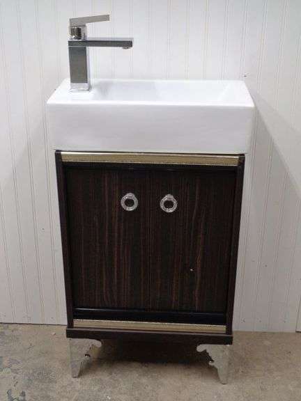 New Vanity, Sink, and Faucet.  Sink and Faucet are not attached. 20x24x10, comes with hardware.  Matches the mirror in the next lot.