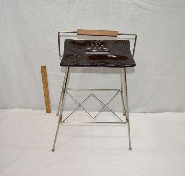 MCM METAL SMOKE STAND W/CERAMIC ASHTRAY. ONE SIMILAR SOLD ON EBAY FOR $146. THE BOTTOM SIDE OF ONE CORNER OF THE ASHTRAY HAS A CHIP, BUT IT CAN'T BE SEEN WITHOUT TURNING IT UPSIDE DOWN
