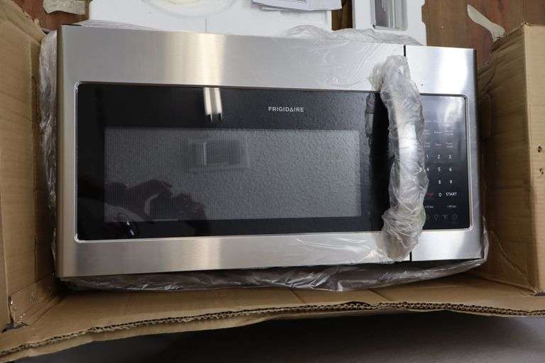 Frigidaire Stainless Steel Over-the-Range Microwave! NEW, but has a large dent from shipping on the top, as shown. Does not affect functionality! Works great! (R3)