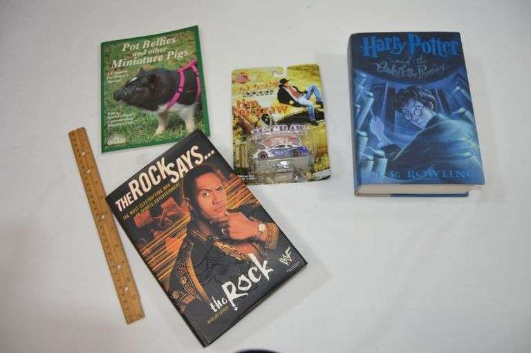 ASSORTED BOOKS & A TIM McGRAW DIE CAST CAR