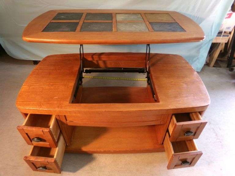 Ashley Lift top wooden coffee table w/ drawers. Very nice piece - top down 46x25x21" and top up 29" tall